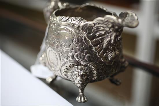 An ornate silver cream jug, 14.5 oz.